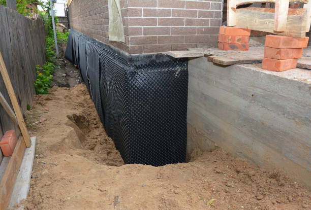 Happy homeowners after waterproofing job in West Harrison